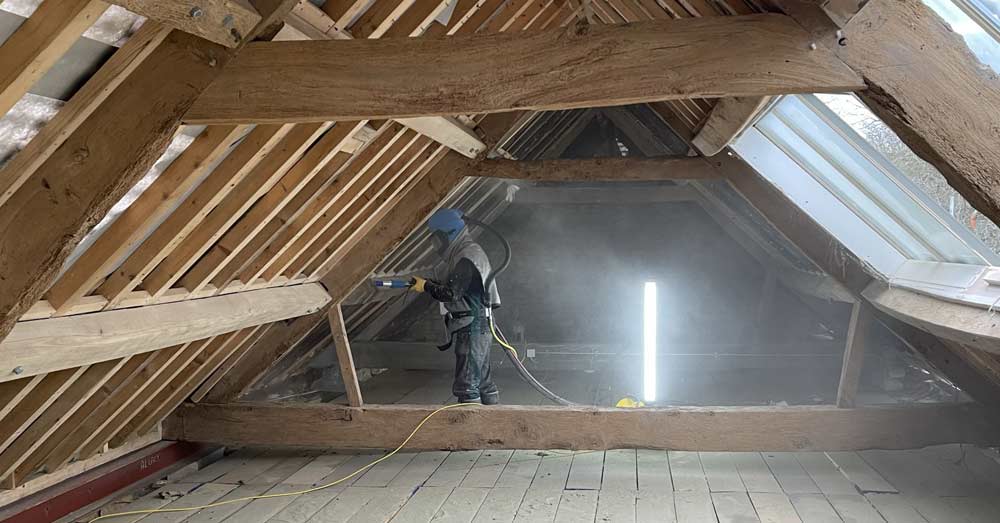 Sensitive cleaning of old roof timbers for roof renovation near Henley, Oxfordshire