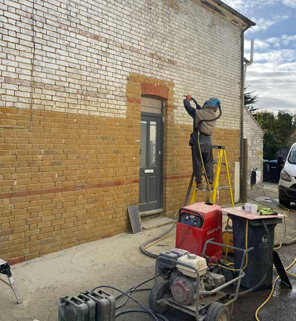 Paint removal from red brick semi-detached in Egham, Surrey