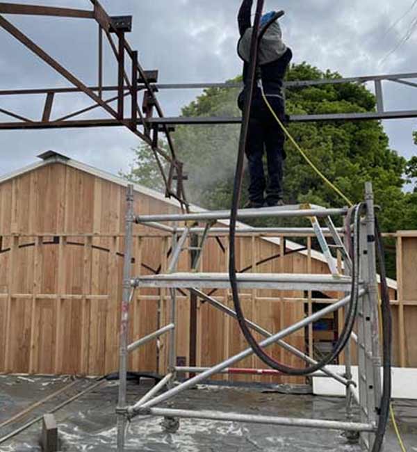 Rust removal from metal frame at construction project near Reading, Berkshire