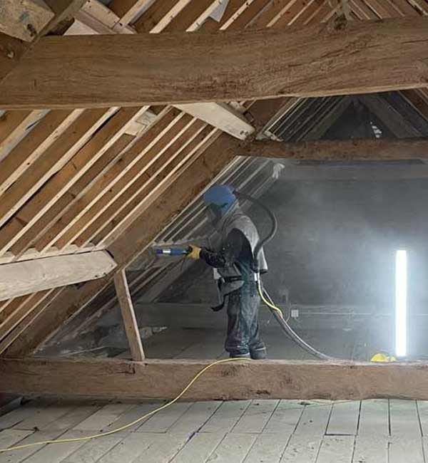 Sensitive cleaning of old roof timbers for roof renovation near Henley, Oxfordshire