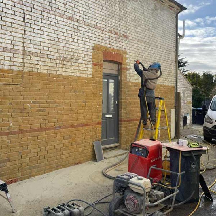 Paint removal from red brick semi-detached in Egham, Surrey