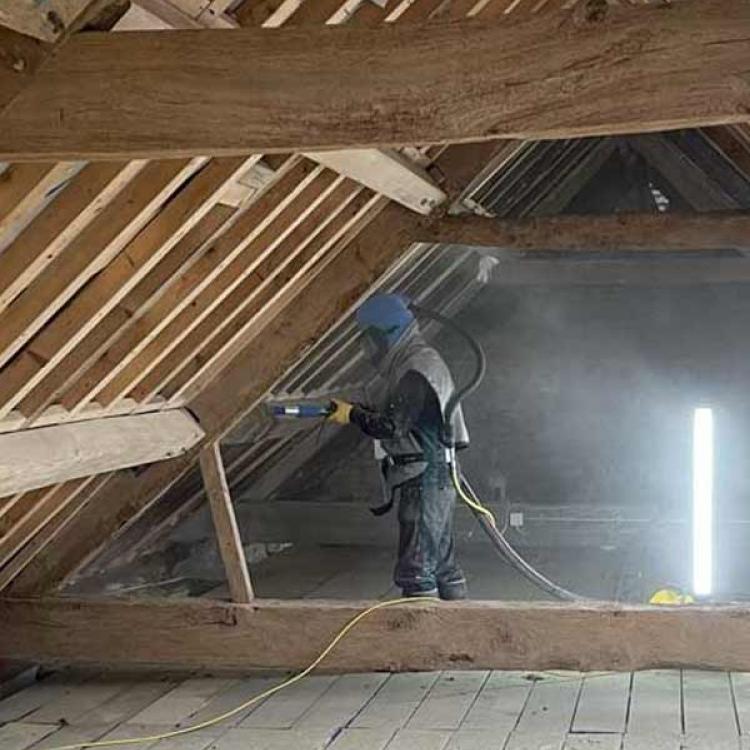 Sensitive cleaning of old roof timbers for roof renovation near Henley, Oxfordshire